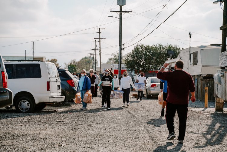 Multiple people at Thanksgiving food drive