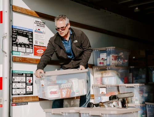 Man packing a bing of food